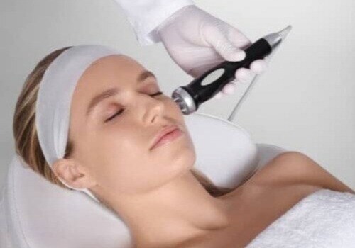 caucasian women receiving facial sknlab treatment-1-1-1